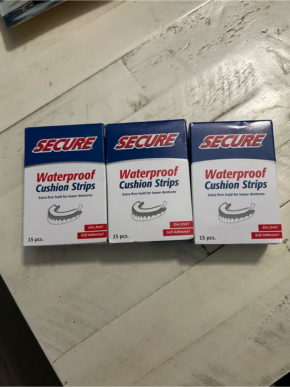 Secure waterproof cushion strips for lower dentures. 3 boxes of 15 pieces each.